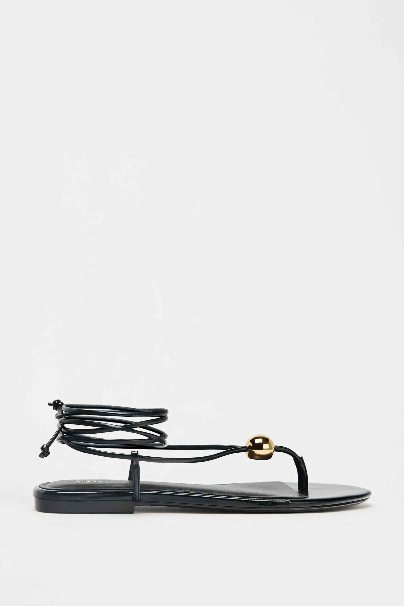 Top Spring Fashion Trends for Moms in Los Angeles: What Stylish Moms Are Wearing Now 29 Flat Sandals With Metallic Appliqué